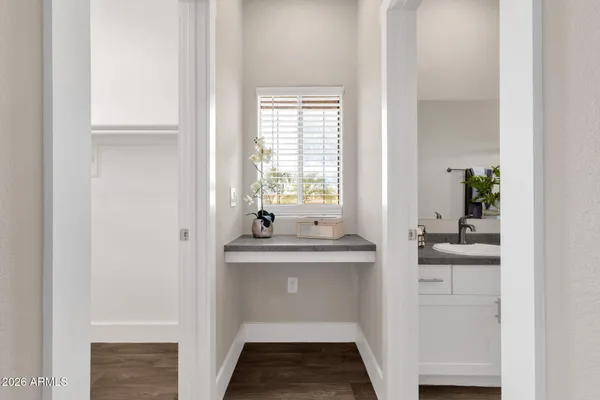 a view of washer and dryer with kitchen in the background