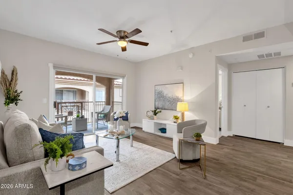 a living room with furniture and a large window