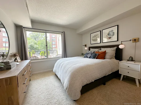 a bed room with a bed and a window
