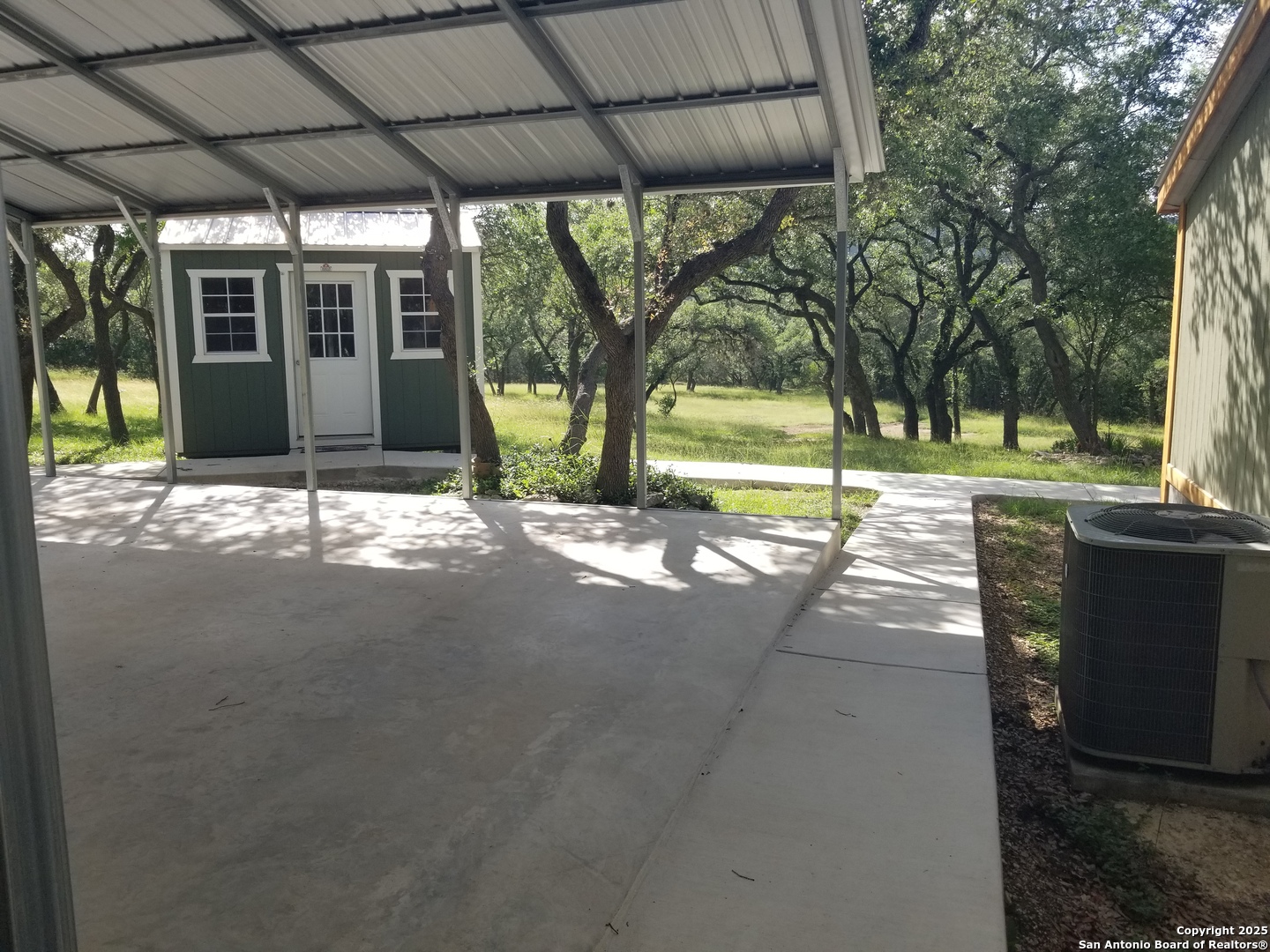 177 Laurel Ridge Drive Lakehills, TX 78063 - Photo 11 of 51 a view of a house with backyard and porch