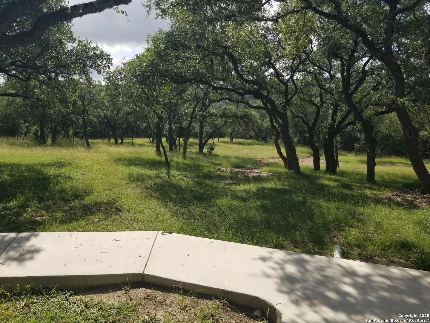 177 Laurel Ridge Drive Lakehills, TX 78063 - Photo 12 of 51 a view of an outdoor space and a yard