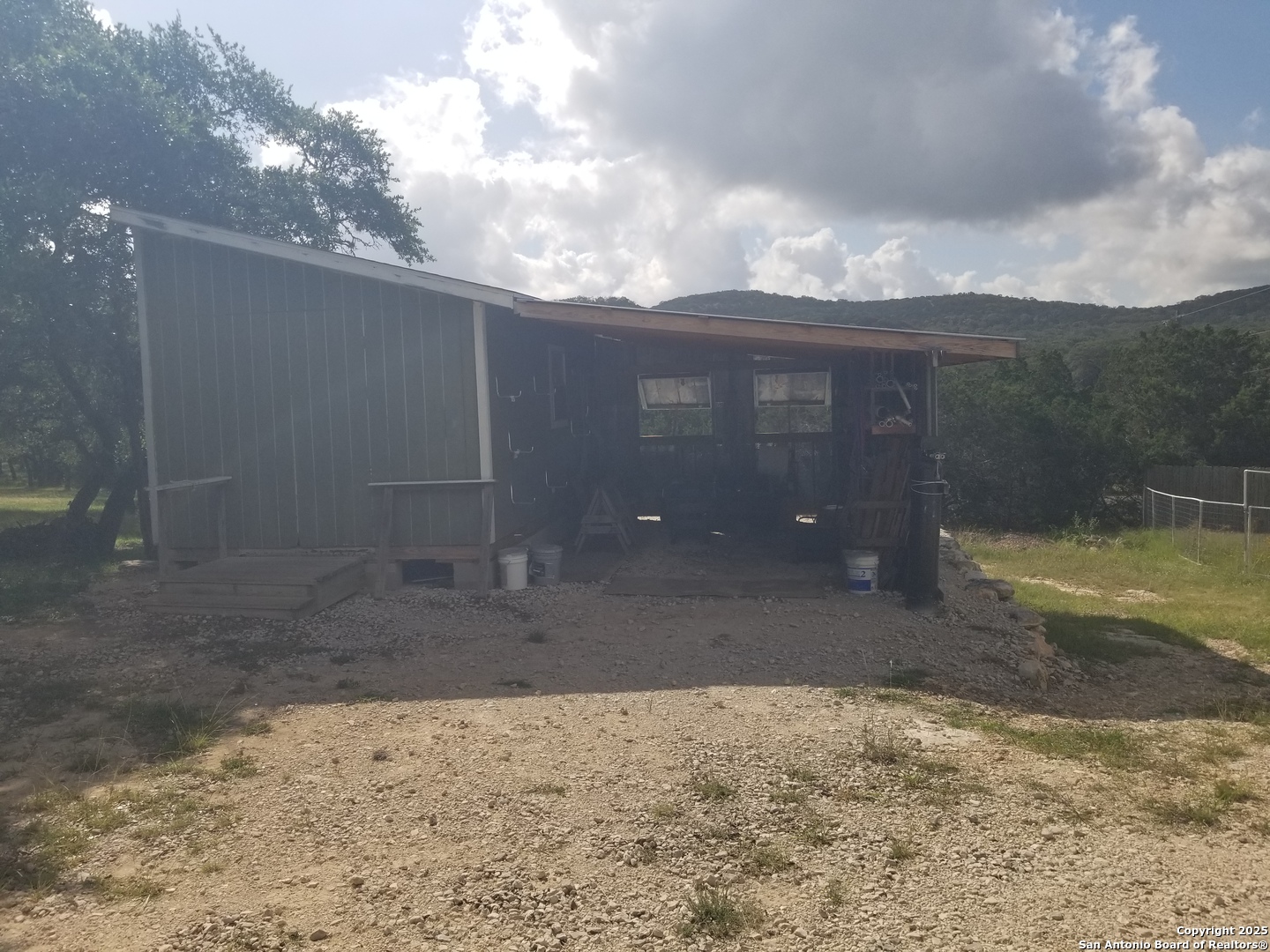 177 Laurel Ridge Drive Lakehills, TX 78063 - Photo 21 of 51 a view of a house with a yard