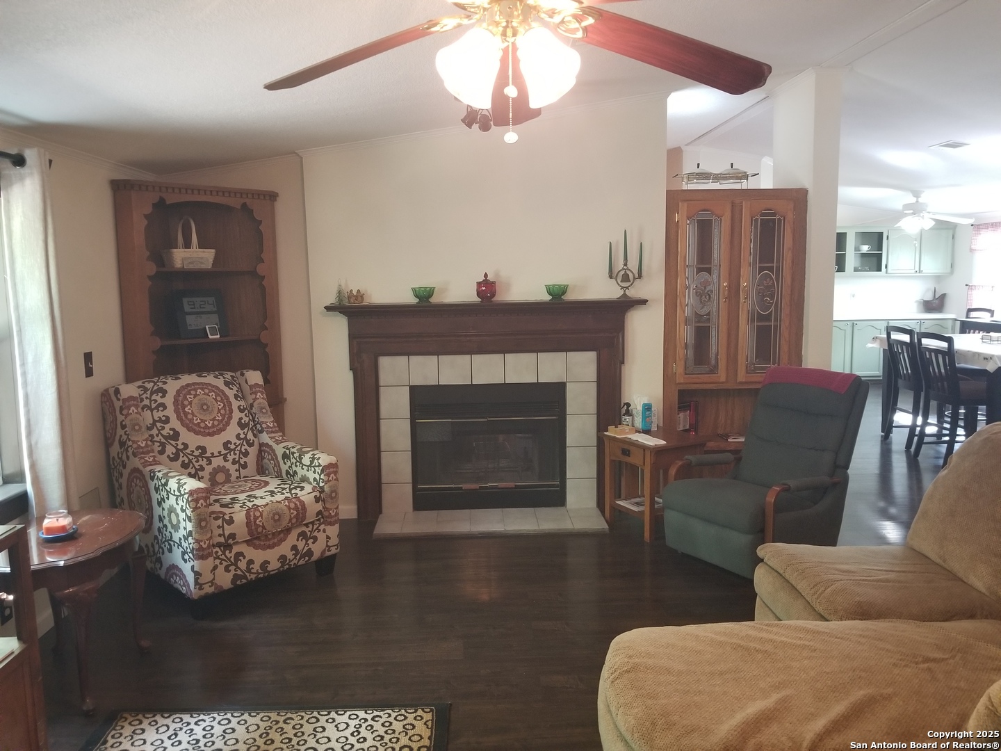 177 Laurel Ridge Drive Lakehills, TX 78063 - Photo 25 of 51 a living room with furniture and a fireplace