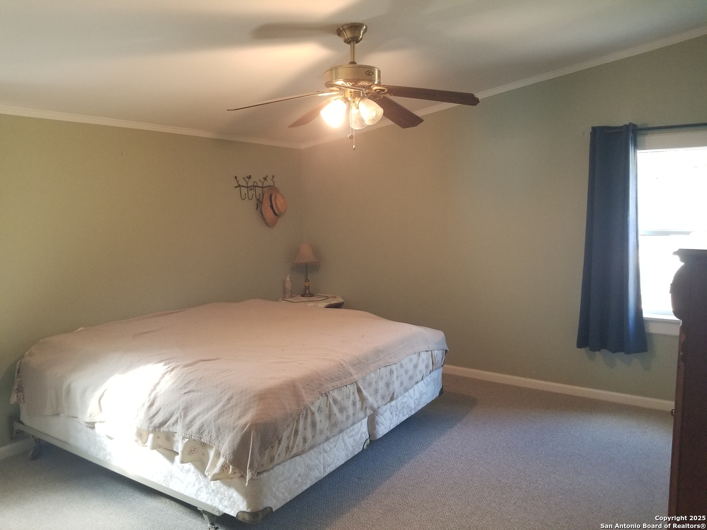 177 Laurel Ridge Drive Lakehills, TX 78063 - Photo 28 of 51 a bedroom with a bed and window