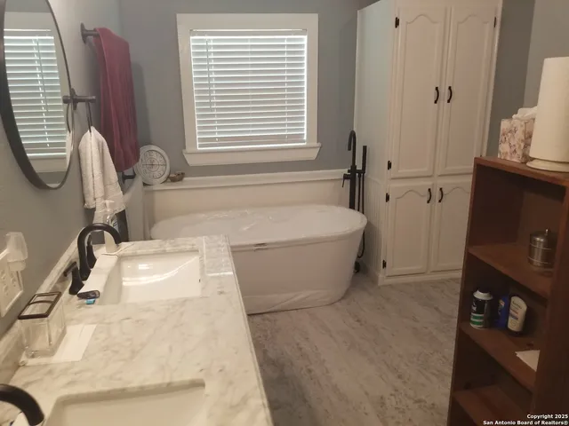 a room with cabinets and washer