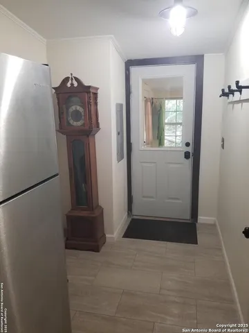 a bathroom with a toilet and a shower curtain