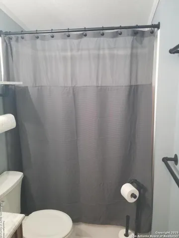 a room with a table chairs and a wooden floor