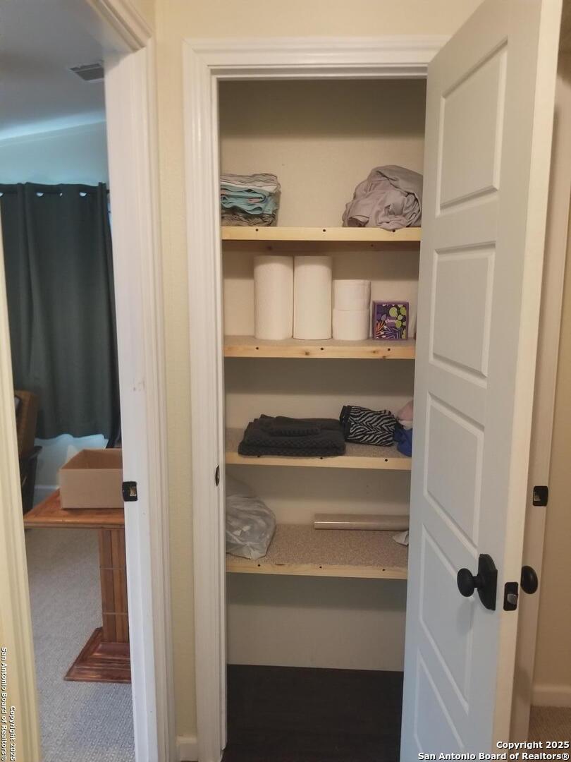177 Laurel Ridge Drive Lakehills, TX 78063 - Photo 43 of 51 a view of walk in closet with clothes and shoes