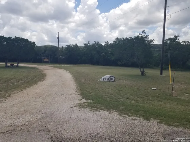 a view of a two chairs in the balcony
