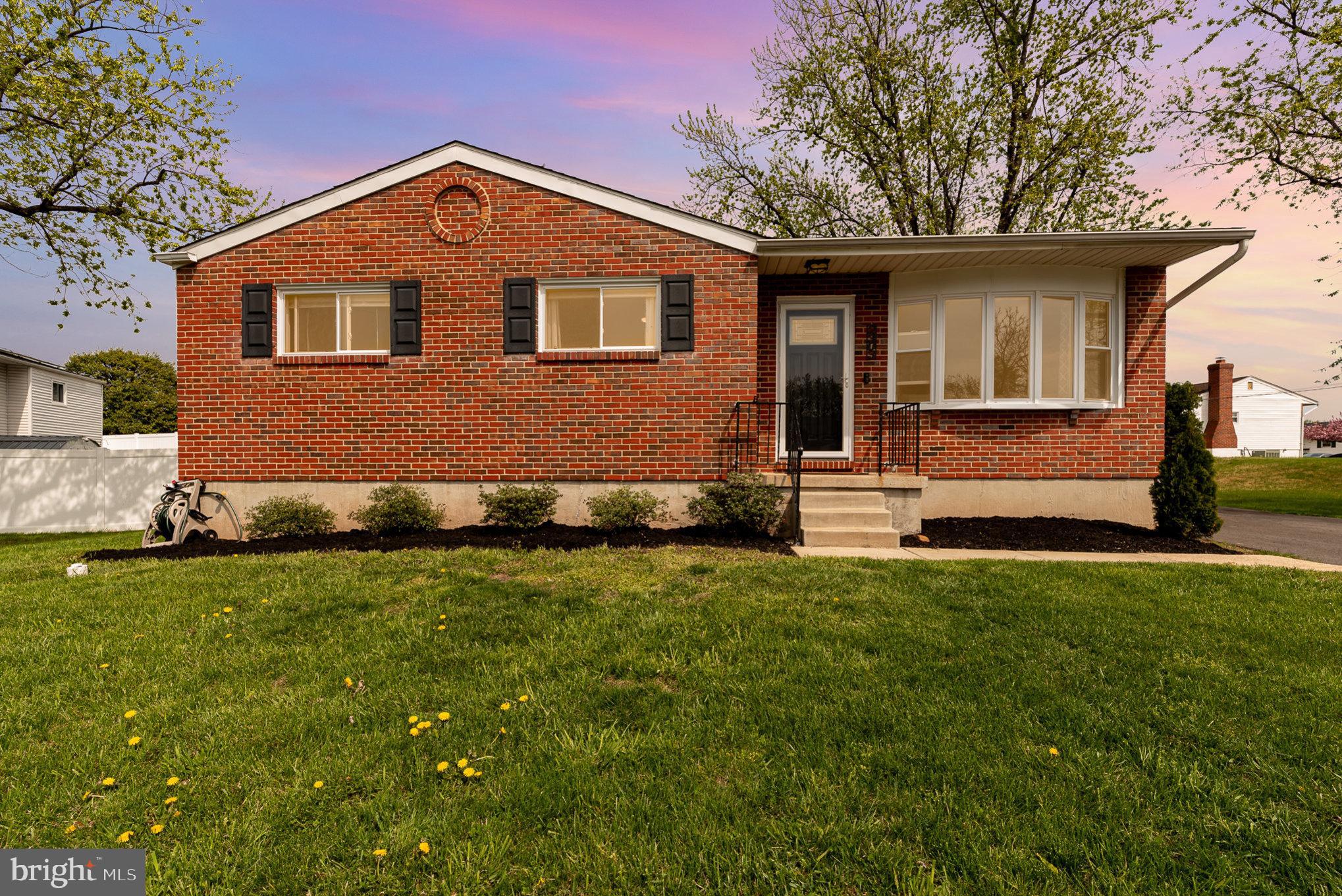 2303 Hamiltowne Circle Rosedale, MD 21237 - Photo 1 of 26 a front view of a house with a yard