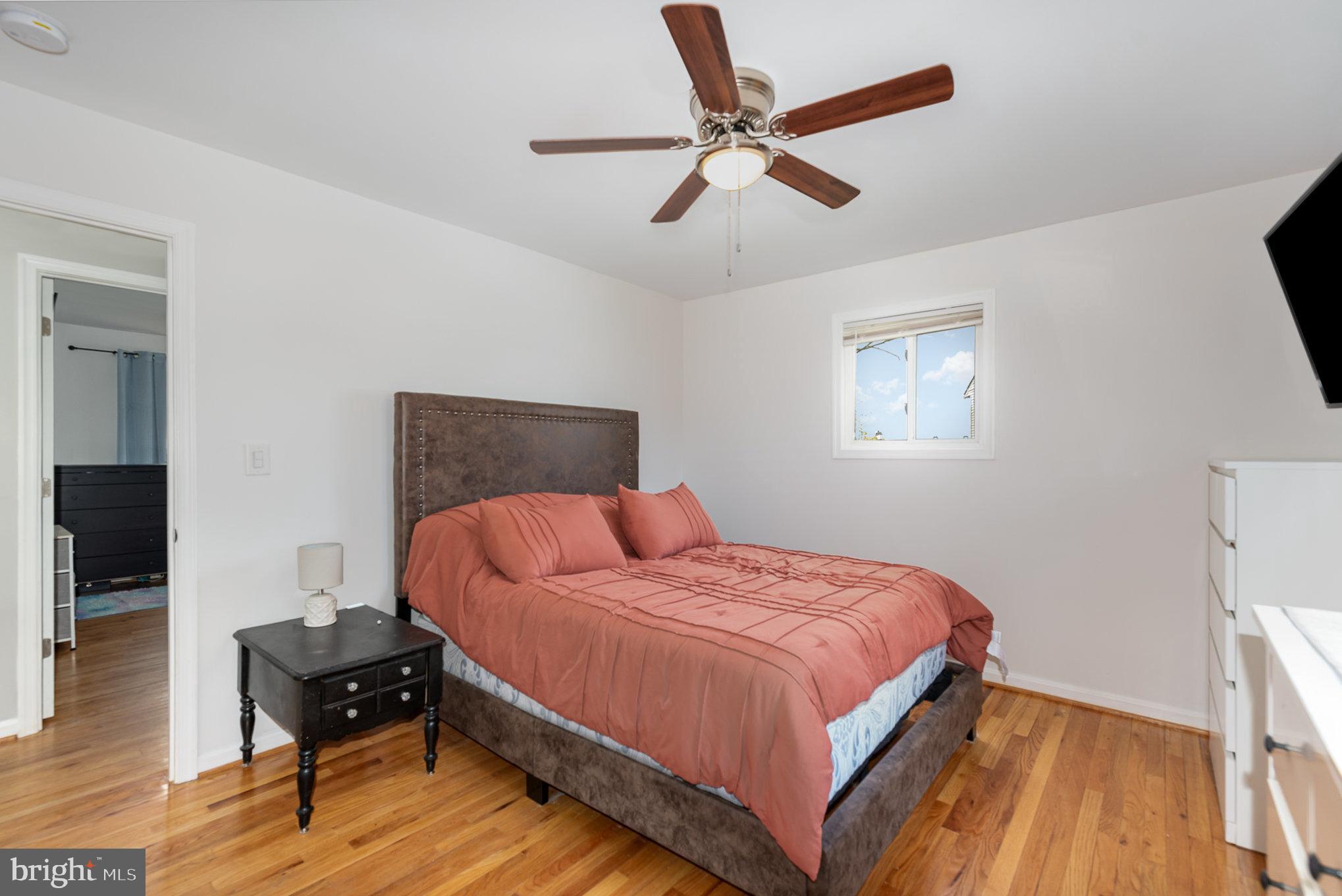 2303 Hamiltowne Circle Rosedale, MD 21237 - Photo 15 of 26 a bedroom with a bed and wooden floor