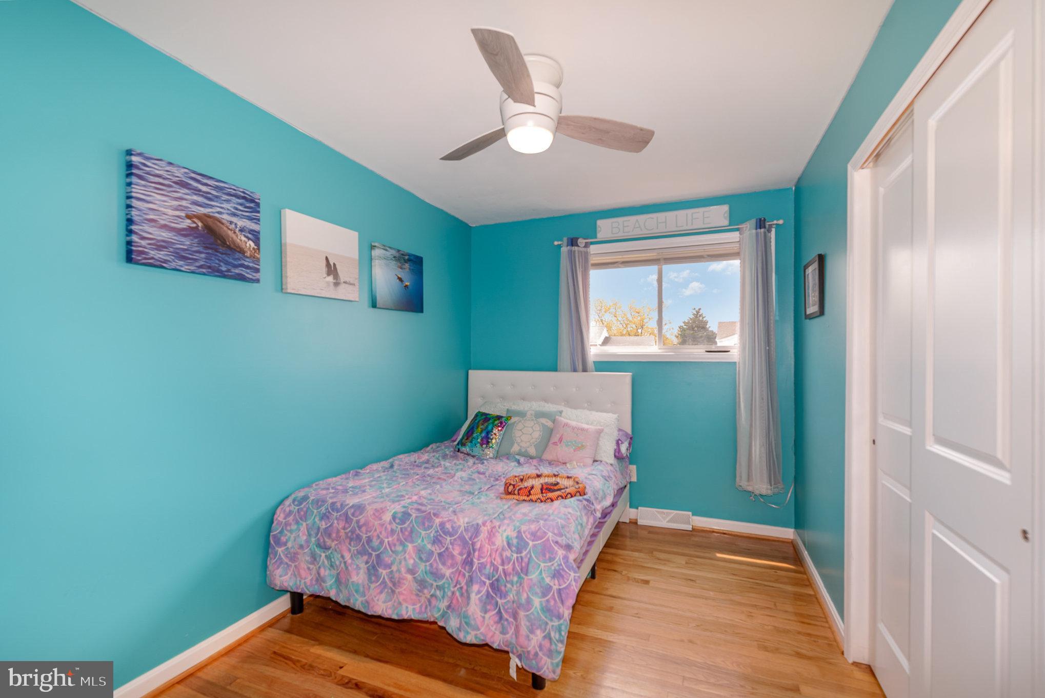 2303 Hamiltowne Circle Rosedale, MD 21237 - Photo 16 of 26 a bedroom with a bed and a window