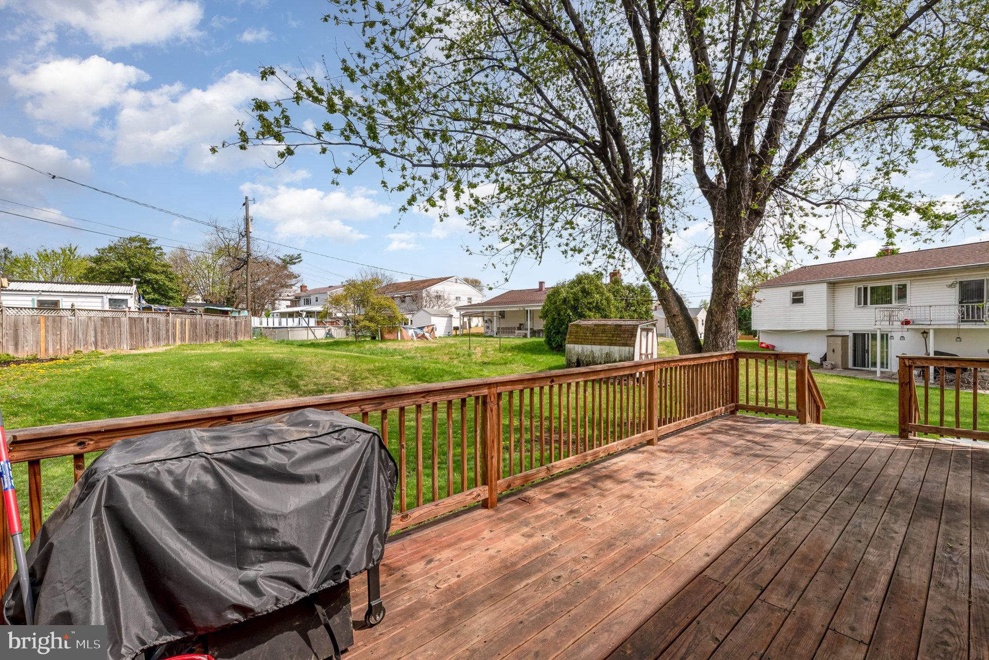 2303 Hamiltowne Circle Rosedale, MD 21237 - Photo 23 of 26 a view of swimming pool with lounge chair and wooden fence