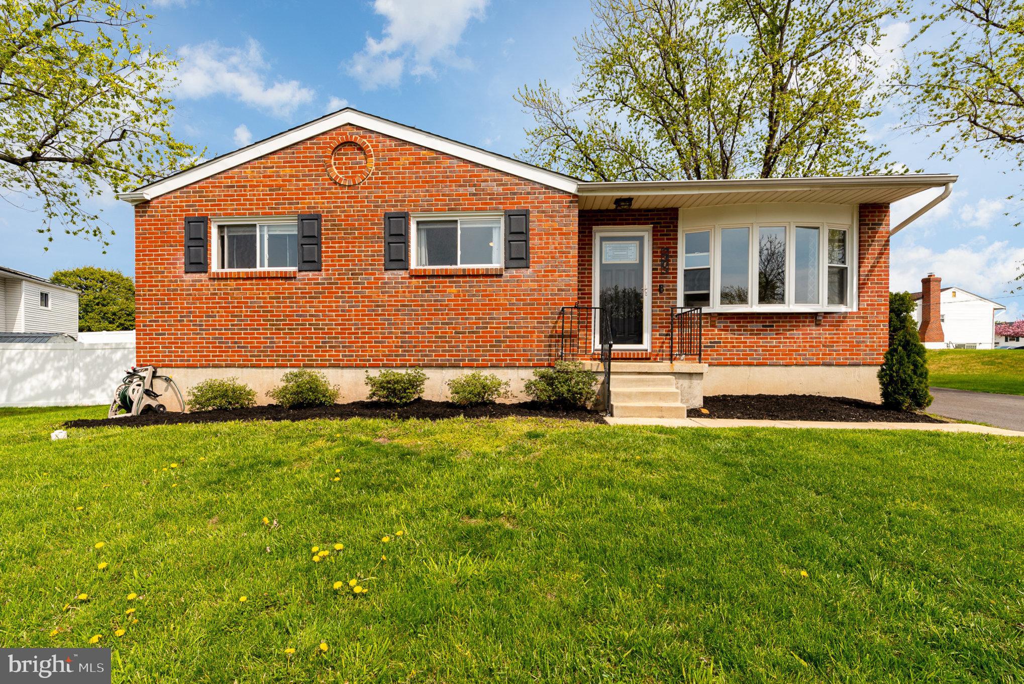 2303 Hamiltowne Circle Rosedale, MD 21237 - Photo 3 of 26 a front view of a house with a yard