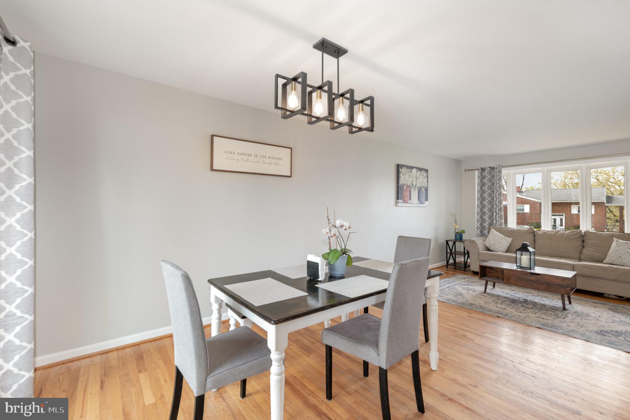 2303 Hamiltowne Circle Rosedale, MD 21237 - Photo 6 of 26 a view of a dining room with furniture and wooden floor