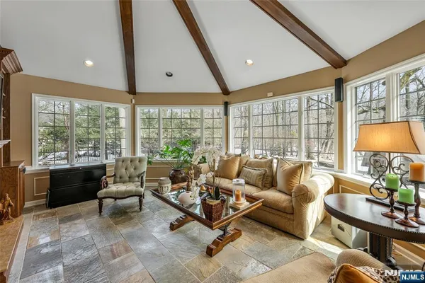 a living room with furniture and a large window