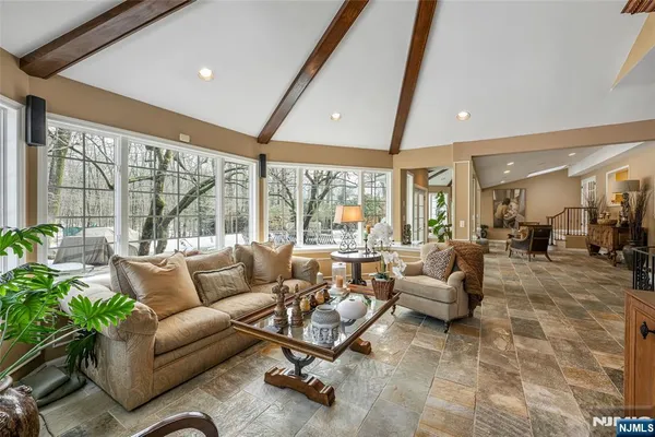 a living room with furniture a rug and a fireplace