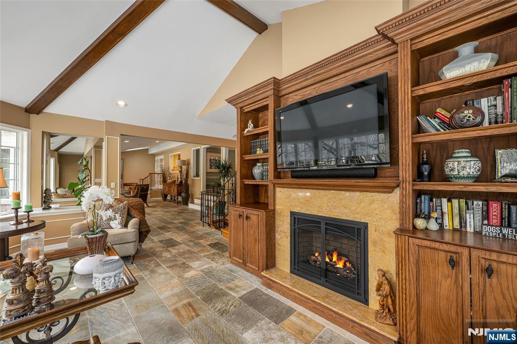 8 White Pine Road Upper Saddle River, NJ 07458 - Photo 14 of 50 a living room with furniture a rug and a fireplace
