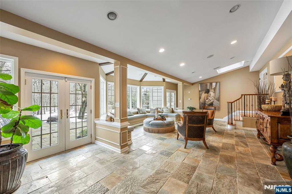 8 White Pine Road Upper Saddle River, NJ 07458 - Photo 16 of 50 a living room with furniture and a flat screen tv