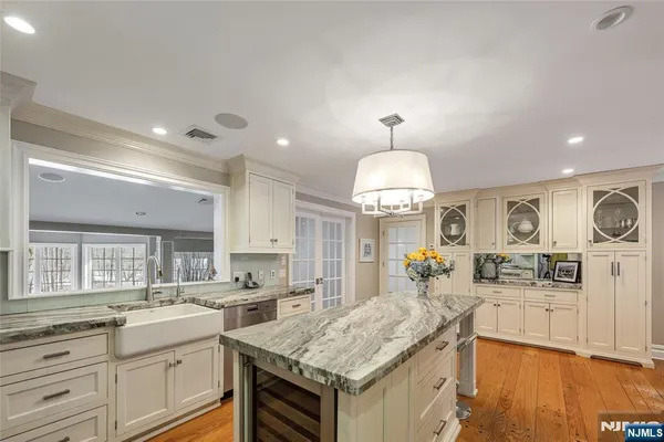 a kitchen with wooden cabinets and a stove top oven