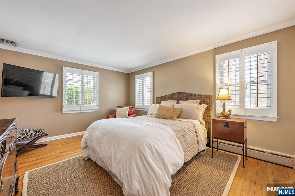 8 White Pine Road Upper Saddle River, NJ 07458 - Photo 28 of 50 a bedroom with a bed and tv