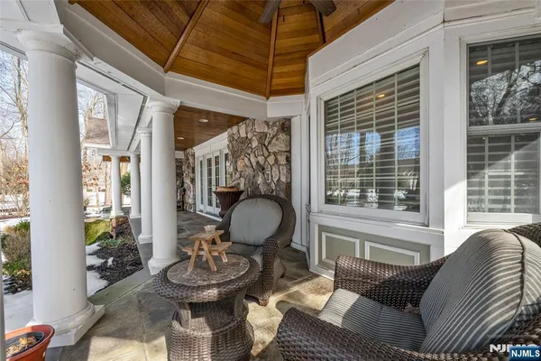 a view of an entryway with wooden floor and windows