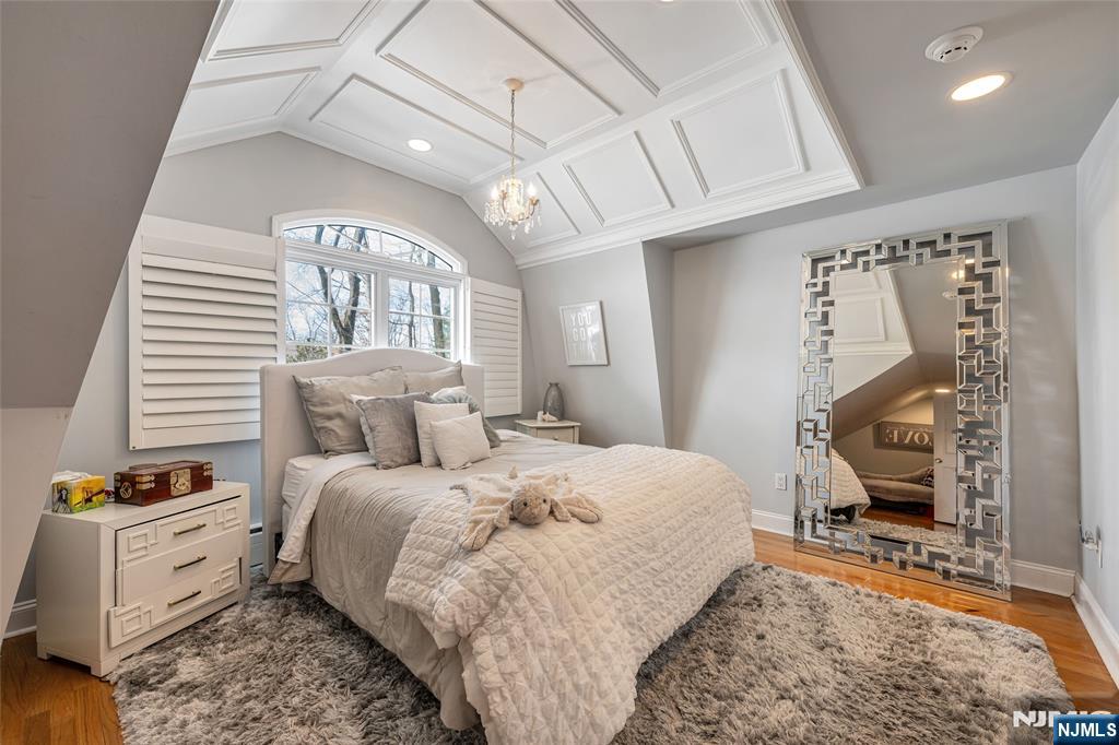 8 White Pine Road Upper Saddle River, NJ 07458 - Photo 34 of 50 a bed room with a bed and a chair