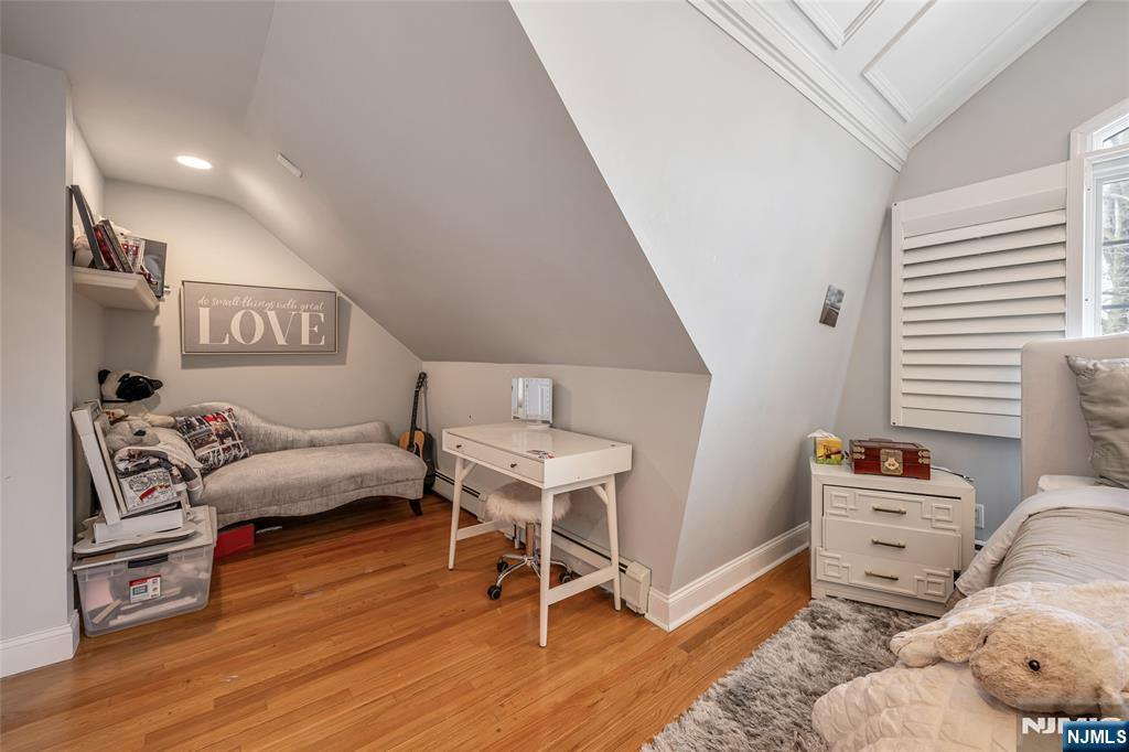 8 White Pine Road Upper Saddle River, NJ 07458 - Photo 35 of 50 a bedroom with furniture and a wooden floor