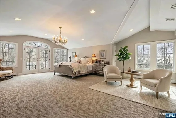 a view of a livingroom with furniture and a large window