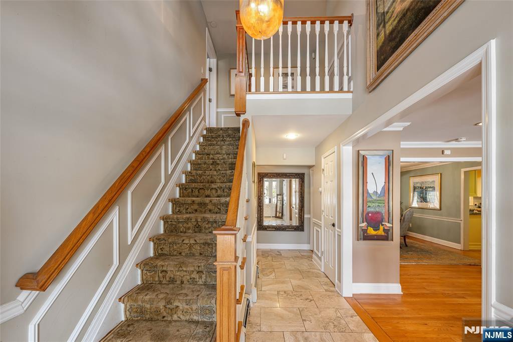 8 White Pine Road Upper Saddle River, NJ 07458 - Photo 4 of 50 a view of an entryway with wooden floor and windows