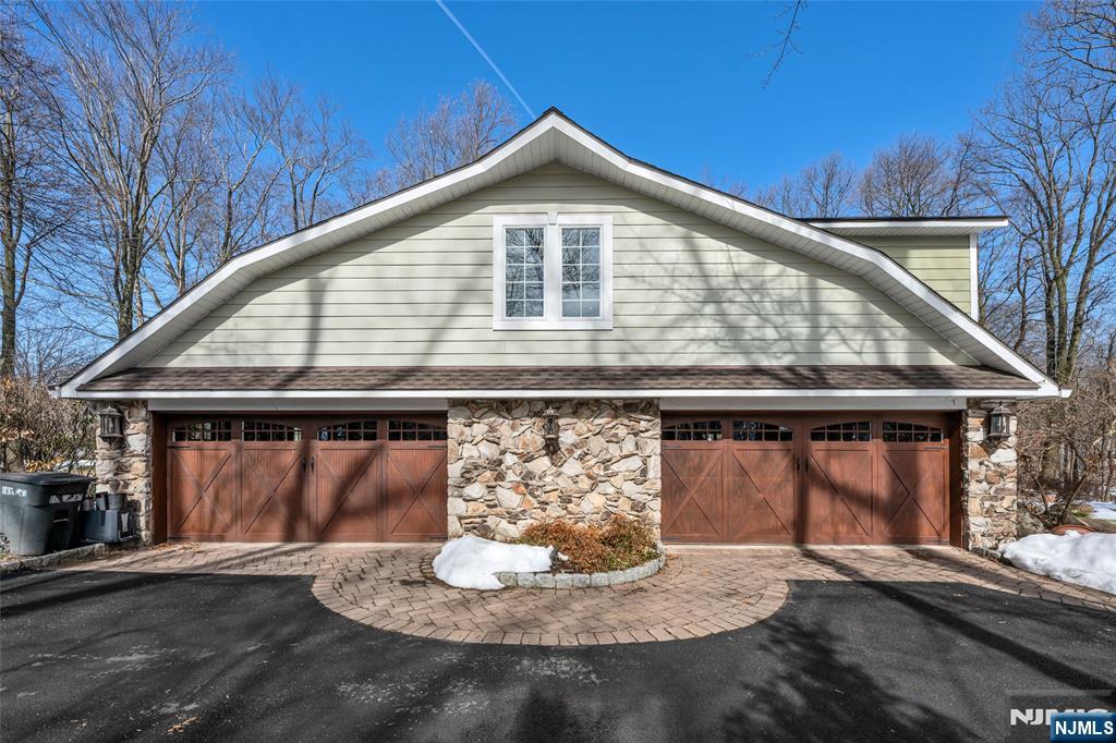 8 White Pine Road Upper Saddle River, NJ 07458 - Photo 49 of 50 a front view of a house with a yard