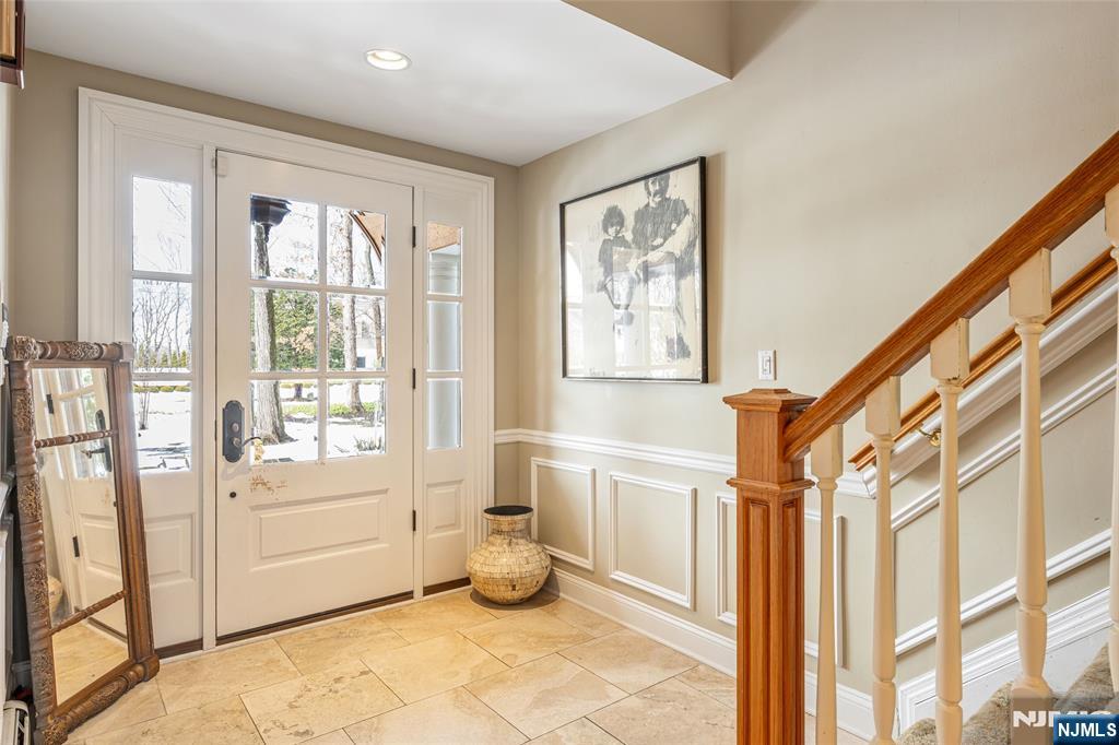 8 White Pine Road Upper Saddle River, NJ 07458 - Photo 5 of 50 a view of an entryway with wooden floor and windows