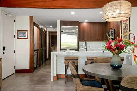 a kitchen with a table and chairs