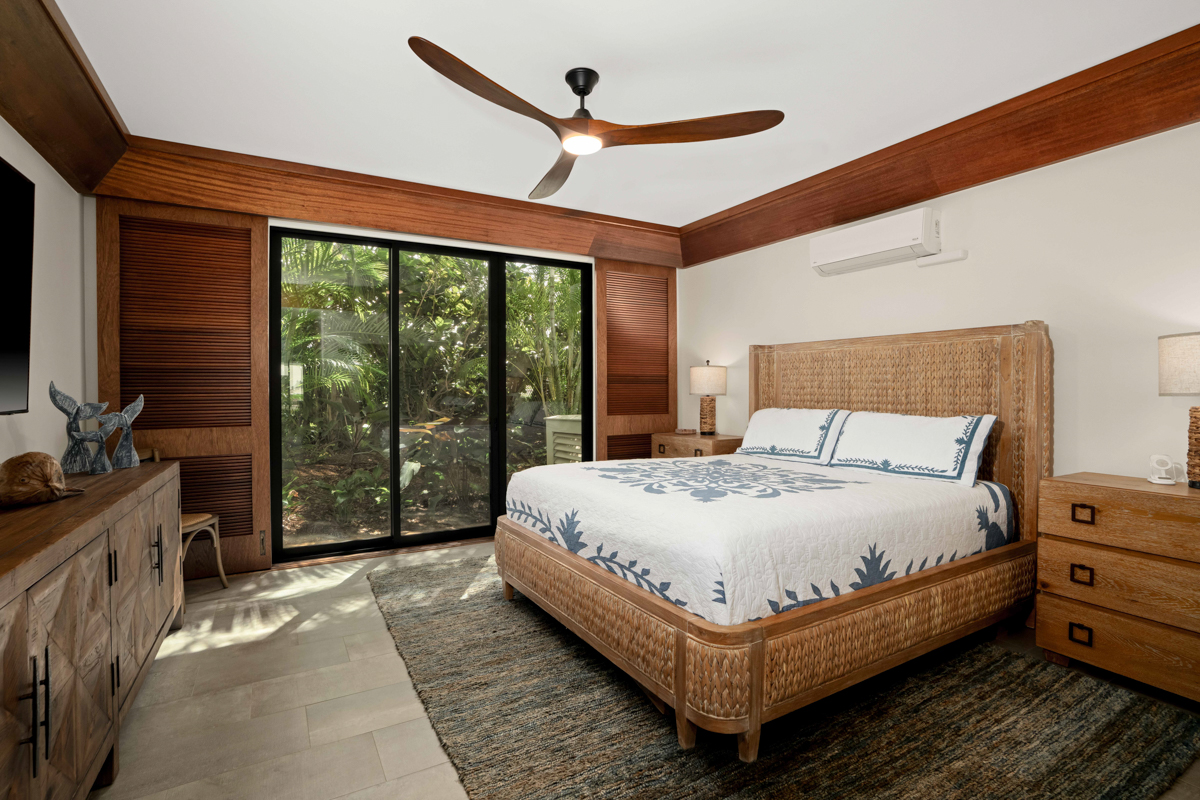 2221 Kapili Road, Unit 45 Koloa, HI 96756 - Photo 12 of 18 a large bed sitting in a bedroom next to a window