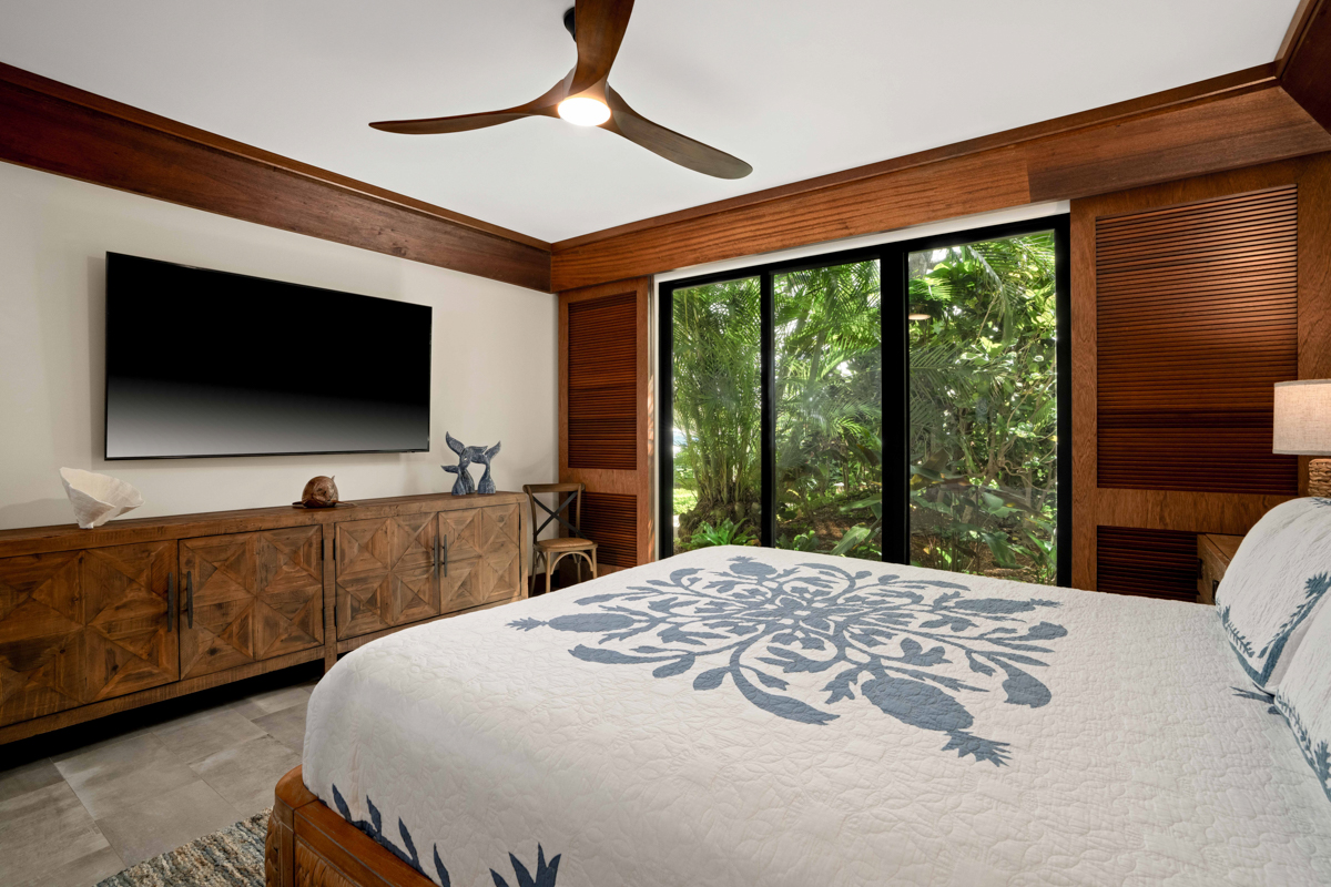2221 Kapili Road, Unit 45 Koloa, HI 96756 - Photo 13 of 18 a bedroom with a bed and a flat tv screen on dresser