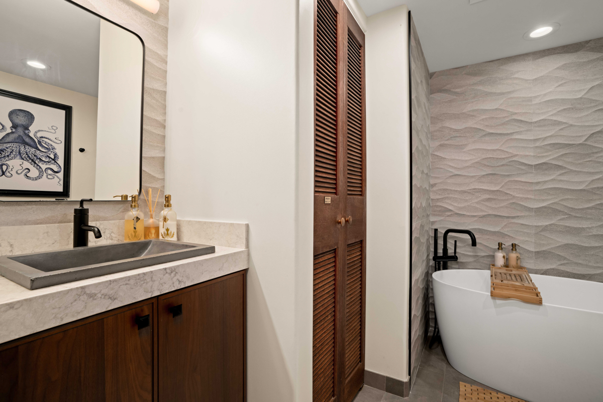 2221 Kapili Road, Unit 45 Koloa, HI 96756 - Photo 14 of 18 a bathroom with a sink and a mirror