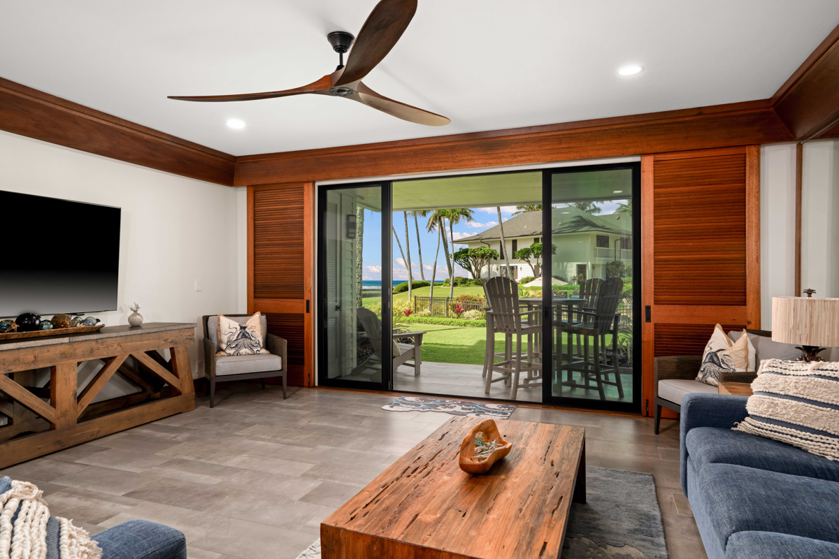 2221 Kapili Road, Unit 45 Koloa, HI 96756 - Photo 5 of 18 a living room with furniture and a flat screen tv