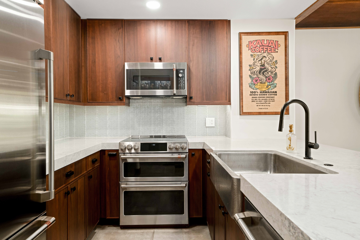 2221 Kapili Road, Unit 45 Koloa, HI 96756 - Photo 7 of 18 a kitchen with a sink stove and microwave