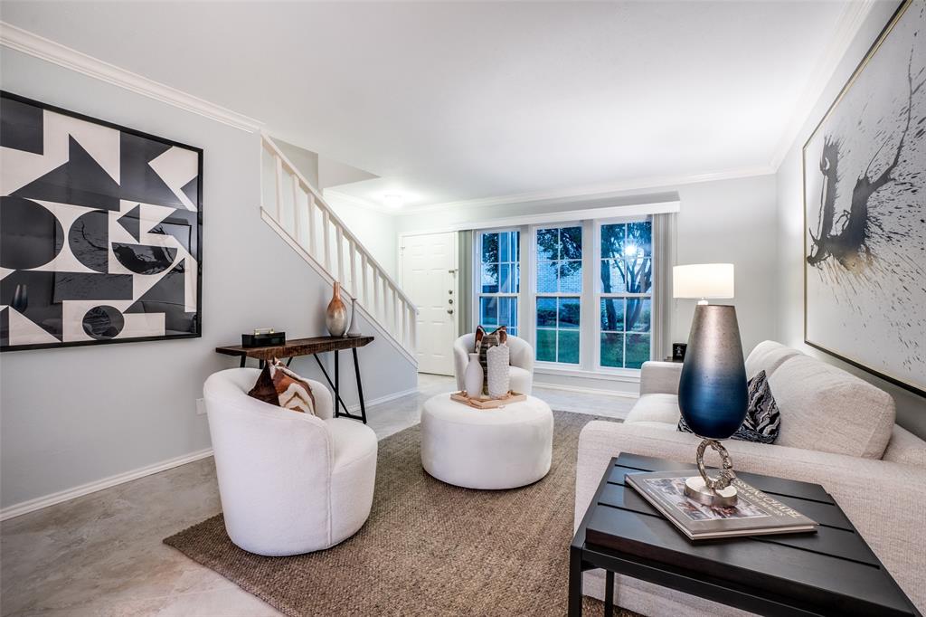5881 Preston View Boulevard, Unit 159 Dallas, TX 75240 - Photo 2 of 12 a living room with furniture and a large window