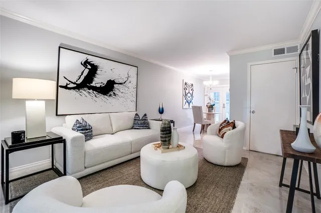 a living room with furniture and a lamp