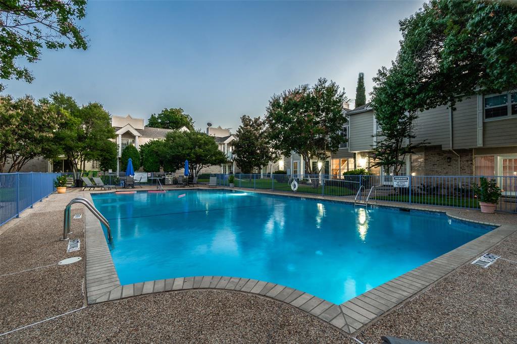 5881 Preston View Boulevard, Unit 159 Dallas, TX 75240 - Photo 10 of 12 a view of a swimming pool and lounge chairs
