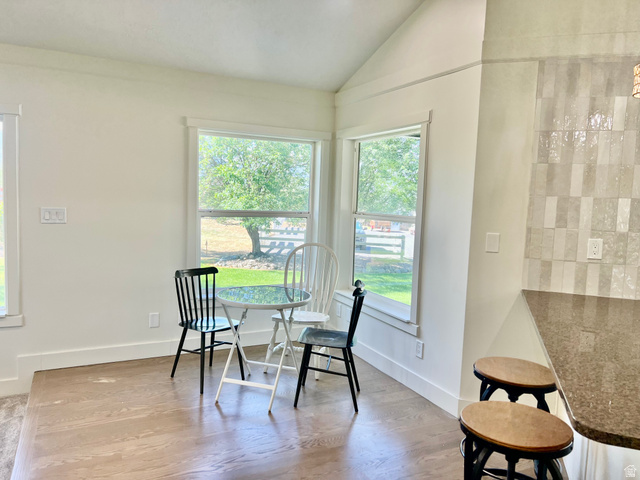 812 East Bates Cyn Road Tooele, UT 84074 - Photo 27 of 144 Bright dining nook featuring large windows, wood-finish flooring, and crisp white baseboards