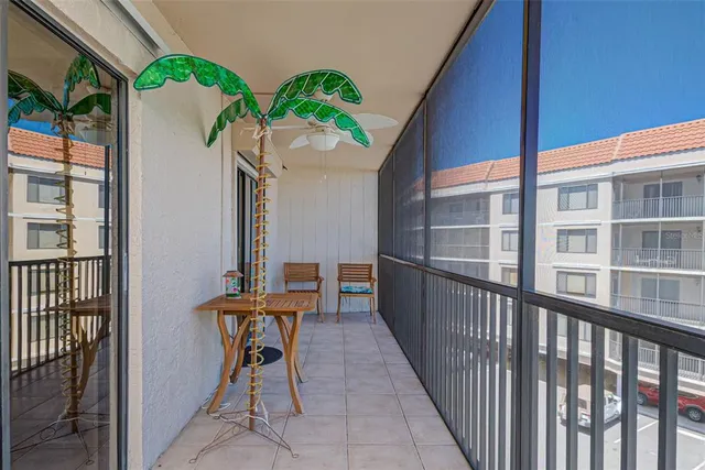 a balcony view with a seating space