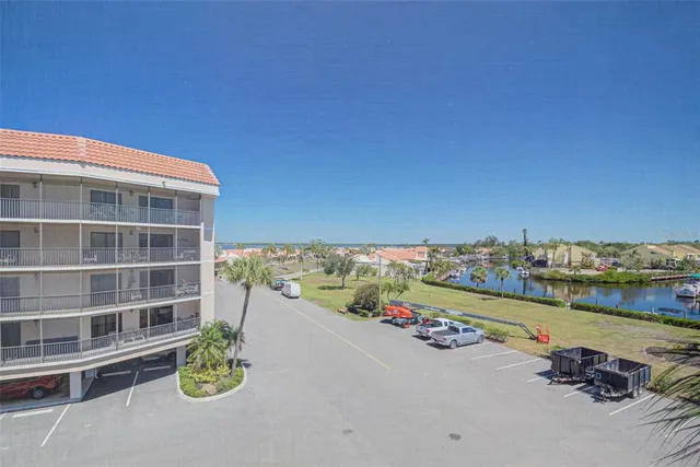 a view of a terrace with chairs and potted plants