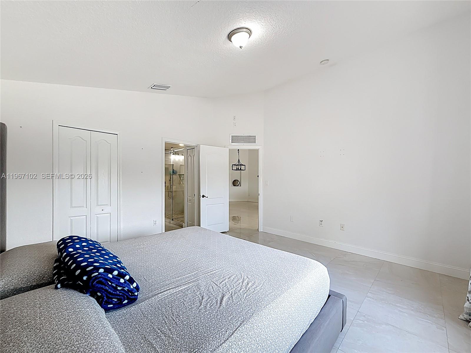 21102 Southwest 92nd Court Cutler Bay, FL 33189 - Photo 24 of 40 a bedroom with a bed and a couch