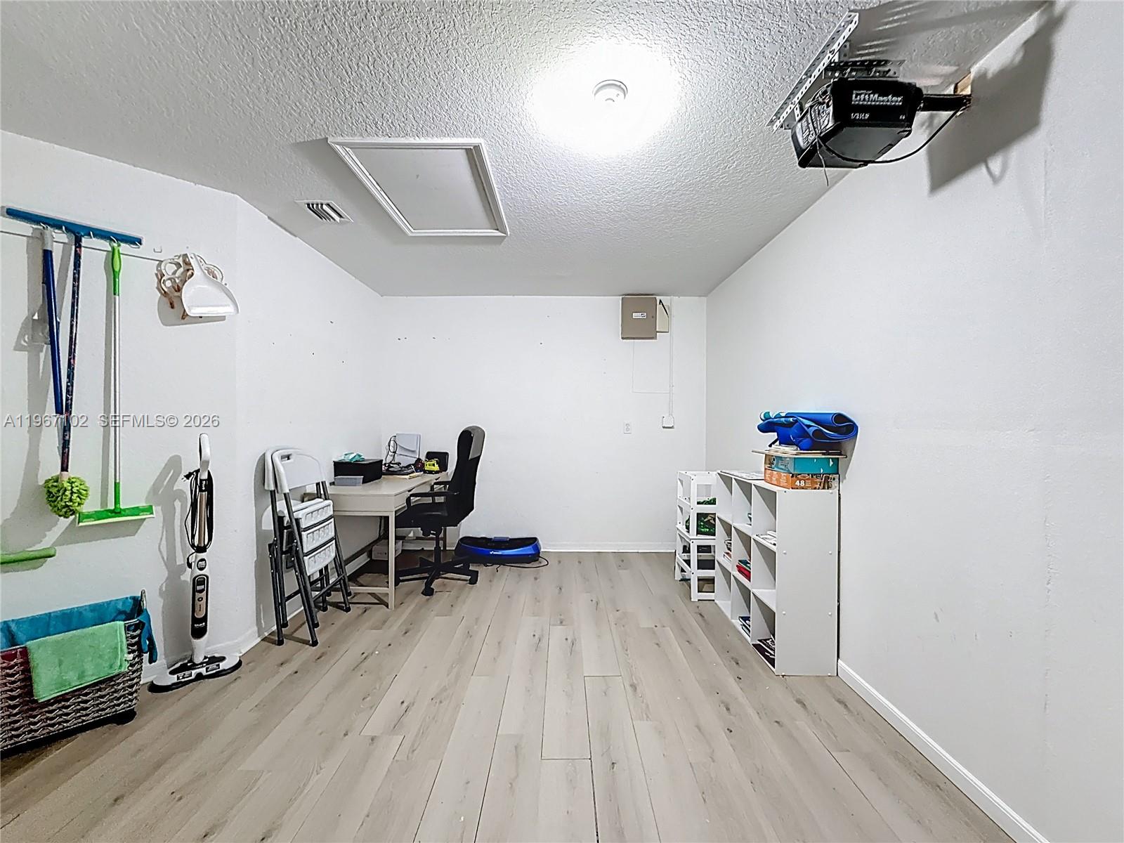 21102 Southwest 92nd Court Cutler Bay, FL 33189 - Photo 27 of 40 a view of a workspace with furniture and wooden floor