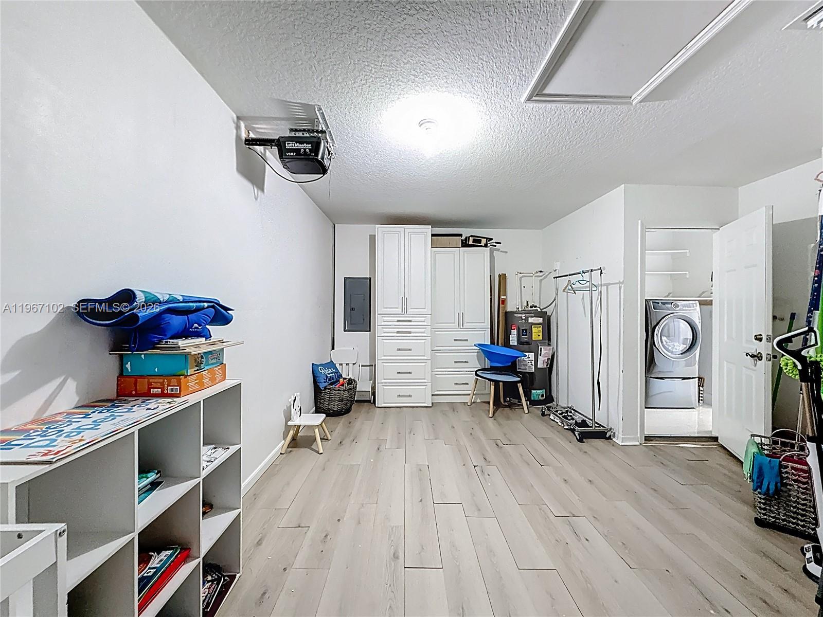 21102 Southwest 92nd Court Cutler Bay, FL 33189 - Photo 28 of 40 a room with furniture and a wooden floor