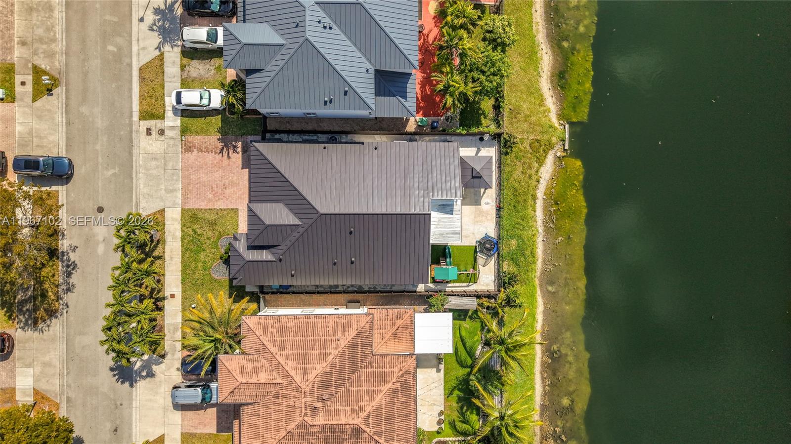 21102 Southwest 92nd Court Cutler Bay, FL 33189 - Photo 38 of 40 an aerial view of a house with a yard