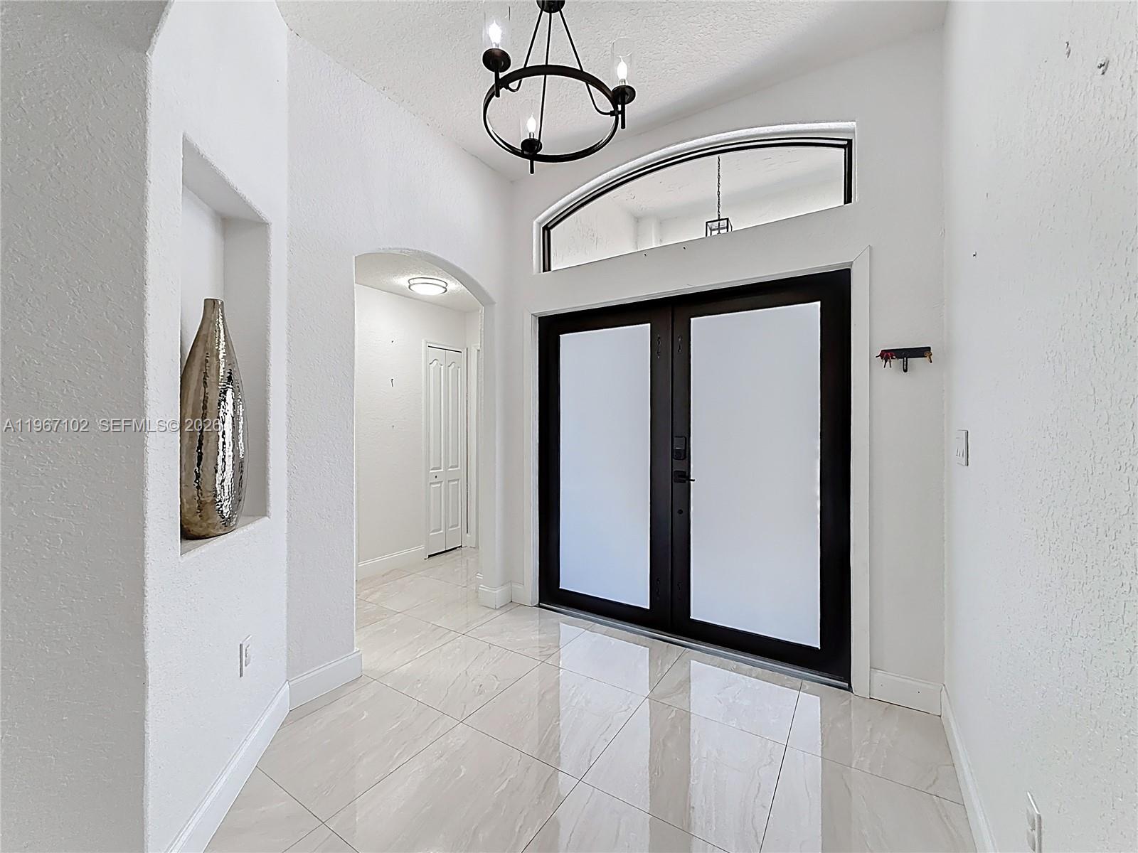 21102 Southwest 92nd Court Cutler Bay, FL 33189 - Photo 5 of 40 a view of a hallway with elevator