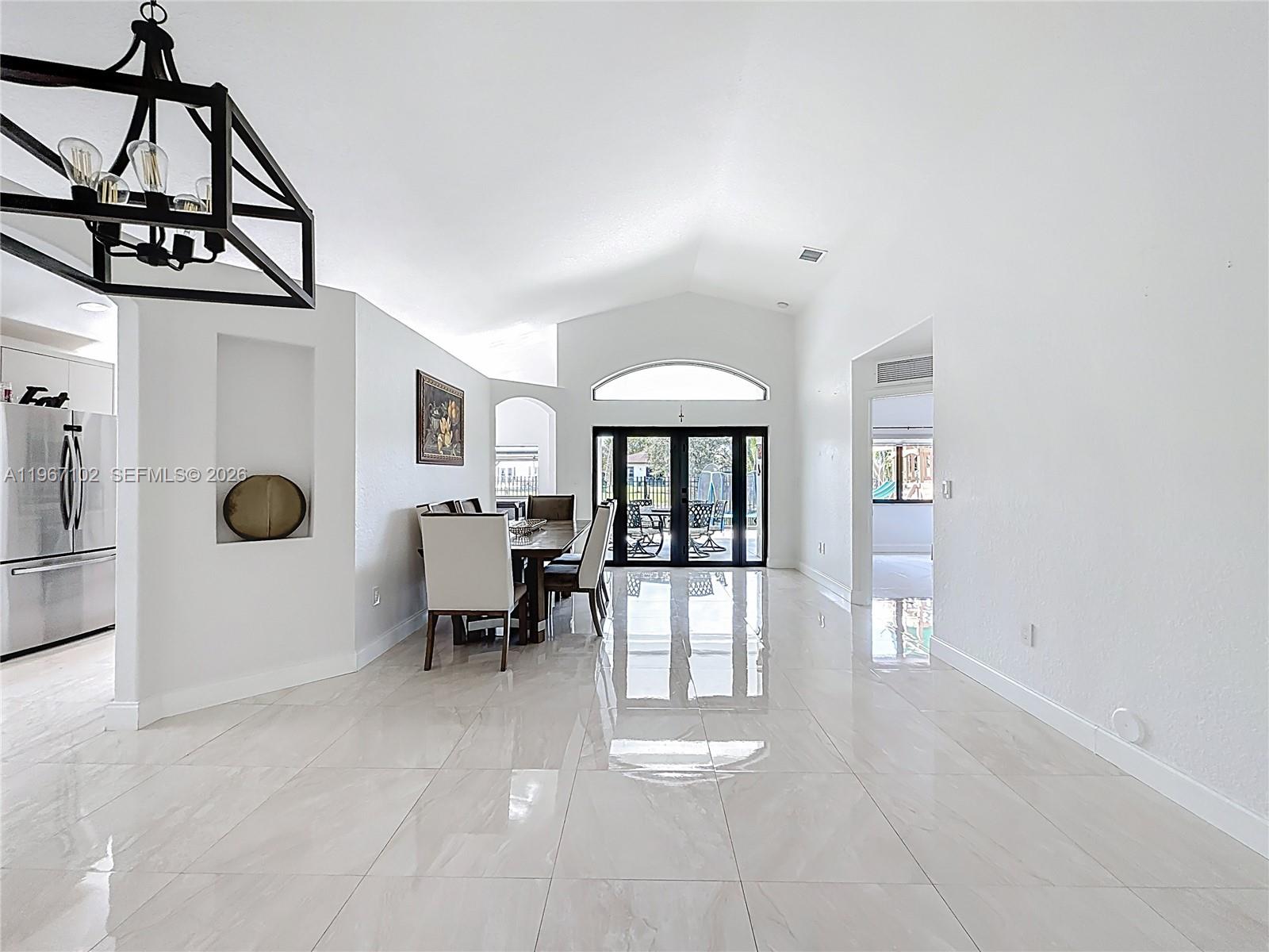 21102 Southwest 92nd Court Cutler Bay, FL 33189 - Photo 6 of 40 a view of an empty room with a window